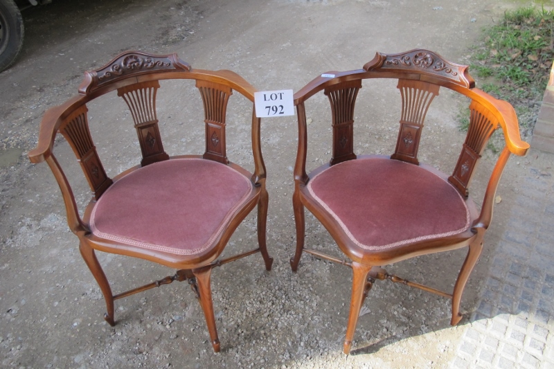 A fine quality pair of Victorian corner chairs upholstered in a dusty pink material (slightly a/f)