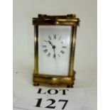 A gilt brass four glass carriage clock (