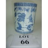 A large blue and white brush pot decorat