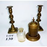 A perfume bottle in brass case and a pai