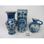 An oriental blue and white jug and two d