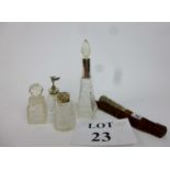 Four scent bottles, some with white meta