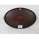 A Sheraton manor mahogany oval tray with central shell motif est: £40-£60 (A1)