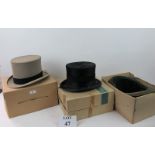 Two boxed top hats and a top hat holder est: £50-£80 (BB36)