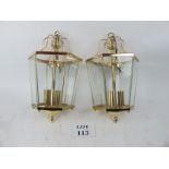 A pair of brass and glass hanging lanter