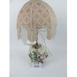 A 20c china lamp with shade est: £20-£40