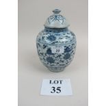 A blue and white Chinese lidded vase (23 cm high approx) est: £50-£80 (M)