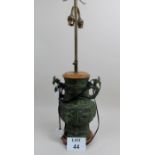 A Chinese green patinated vase now fitted as a table lamp,