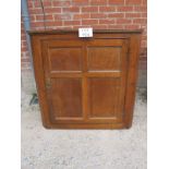 A 19c oak corner cupboard with panelled