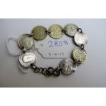 A silver 3d coin bracelet with eight sil