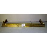 A decorative brass fire fender est: £40-