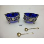 A pair of silver salts with pierced deco