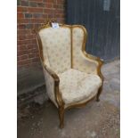 A French gilt framed armchair upholstere