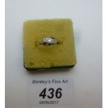 A 9ct gold three stone diamond ring (siz