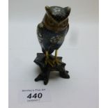 A Chinese cloisonné owl on wooden stand