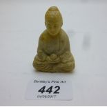 A Chinese pendant of a seated Buddha hol