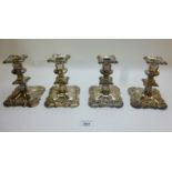 A set of four plated candlesticks (appro