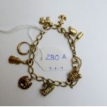 A 9ct gold charm bracelet with nine char