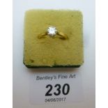 An 18ct gold diamond solitaire ring (siz