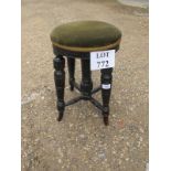 A small 19c ebony stool with green uphol