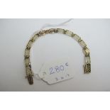 A 14ct gold bracelet with gold pierced f