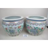 Two large Chinese fish bowls with painte