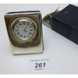 A small silver fronted clock fully hallm