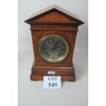 A c1900 walnut cased mantel clock with c