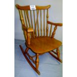 A 20c pine spindle back rocking chair wi