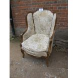 A French walnut framed armchair upholste