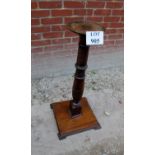 A decorative carved mahogany torchere st