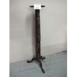 A Victorian carved mahogany torchere sta