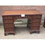 A late 19c mahogany writing desk/kneehol