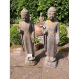 A pair of stone Cambodian temple figures