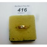 An 18ct gold ring inset with three diamo