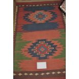 A Kilim rug (124 x 80 cm approx) est: £4