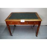 A 19c oak two drawer writing table with