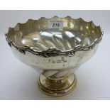 A silver pedestal bowl with leaf edge de