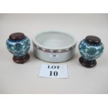 A Chinese shallow bowl and a pair of small Chinese pots with wooden lids and stands est: £30-£50