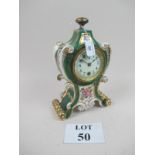 A French porcelain mantel clock (rear cover missing) est: £50-£80 (G2)