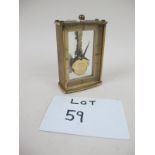 A Kaiser small glass and brass clock 8 day German movement (one small foot missing) est: £30-£50