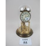 A Kundo glass dome clock with painted dial and revolving balance wheel (a/f) est: £30-£50 (G2)