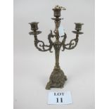 An ornate brass embossed candelabra est: £20-£30 (A1)