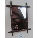 A bamboo design wall mirror est: £15-£40 (K3)