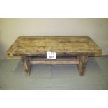 A rustic oak low coffee table with centre stretched (believed to have survived the Brighton Pier