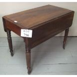 A 19c mahogany Pembroke table with single blind drawer to one end over reeded legs and casters est: