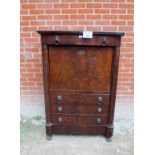 A fine 19c flame mahogany escritoire with one long and five small drawers in interior over three