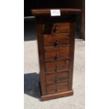 A 20c hardwood slim chest of six drawers in clean condition est: £50-£80