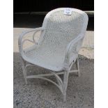 A white painted and caned conservatory elbow chair est: £30-£50