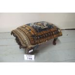 A small 20c mahogany upholstered stool with a saddle bag cover est: £30-£50